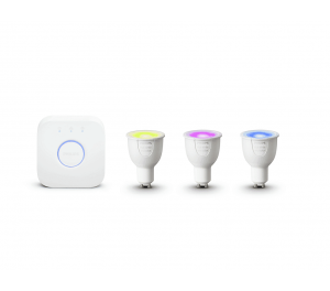 The Philips Hue Starter Kit, featuring a smart lighting hub and three color-changing LED light bulbs, is displayed. The bulbs radiate a captivating trio of yellow, pink, and blue hues.